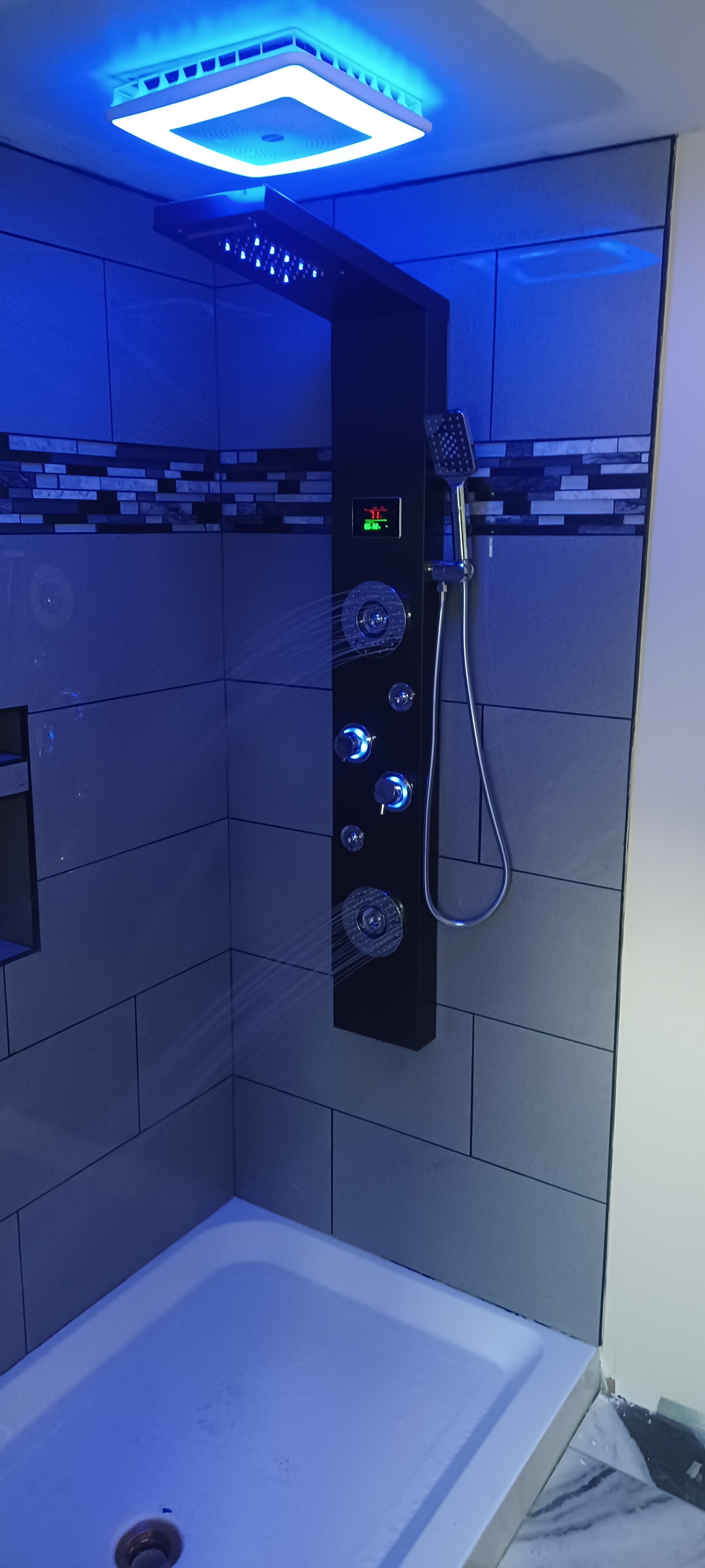 Custom tile shower with shower tower