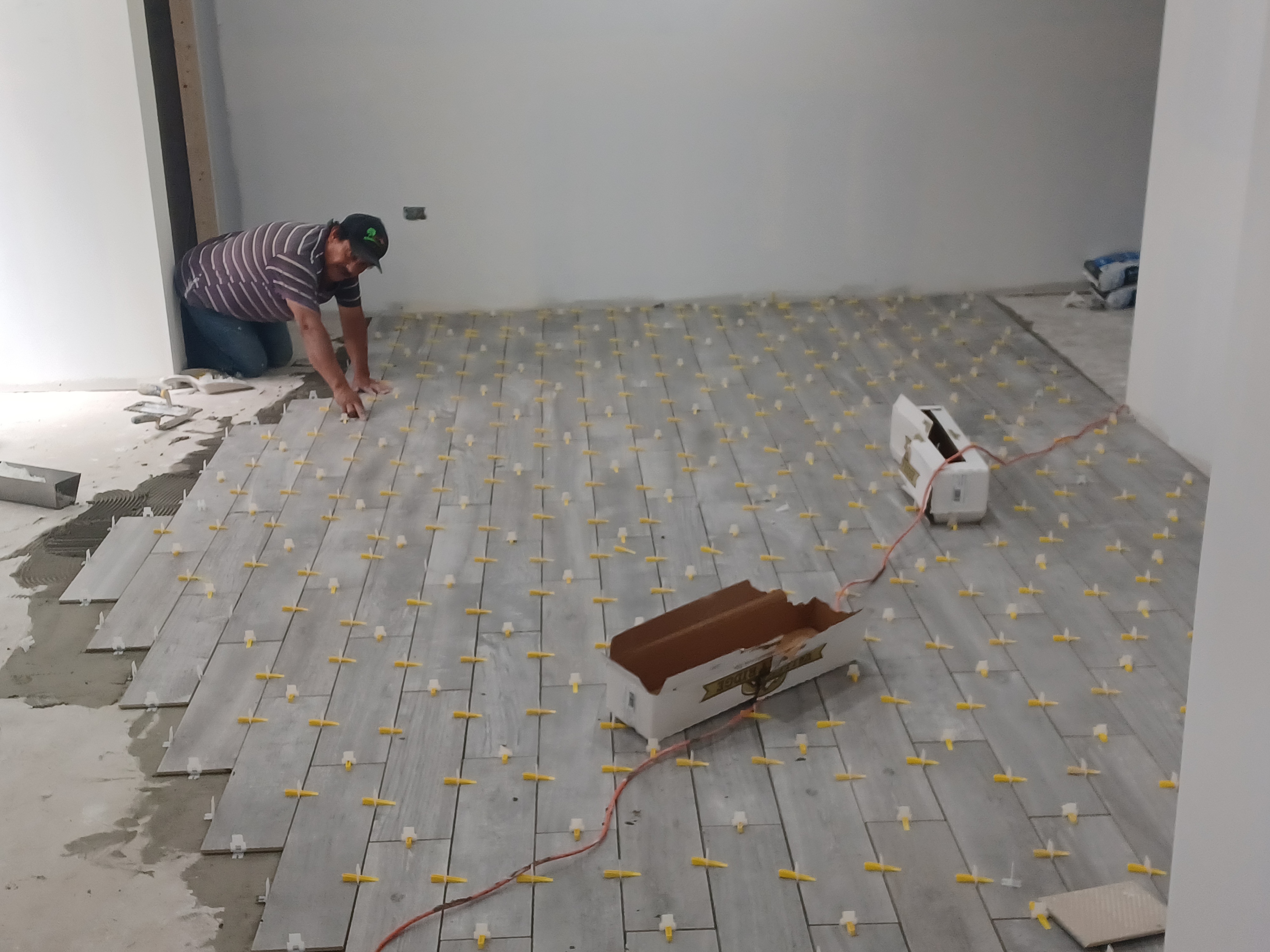 Tile flooring installation in progress