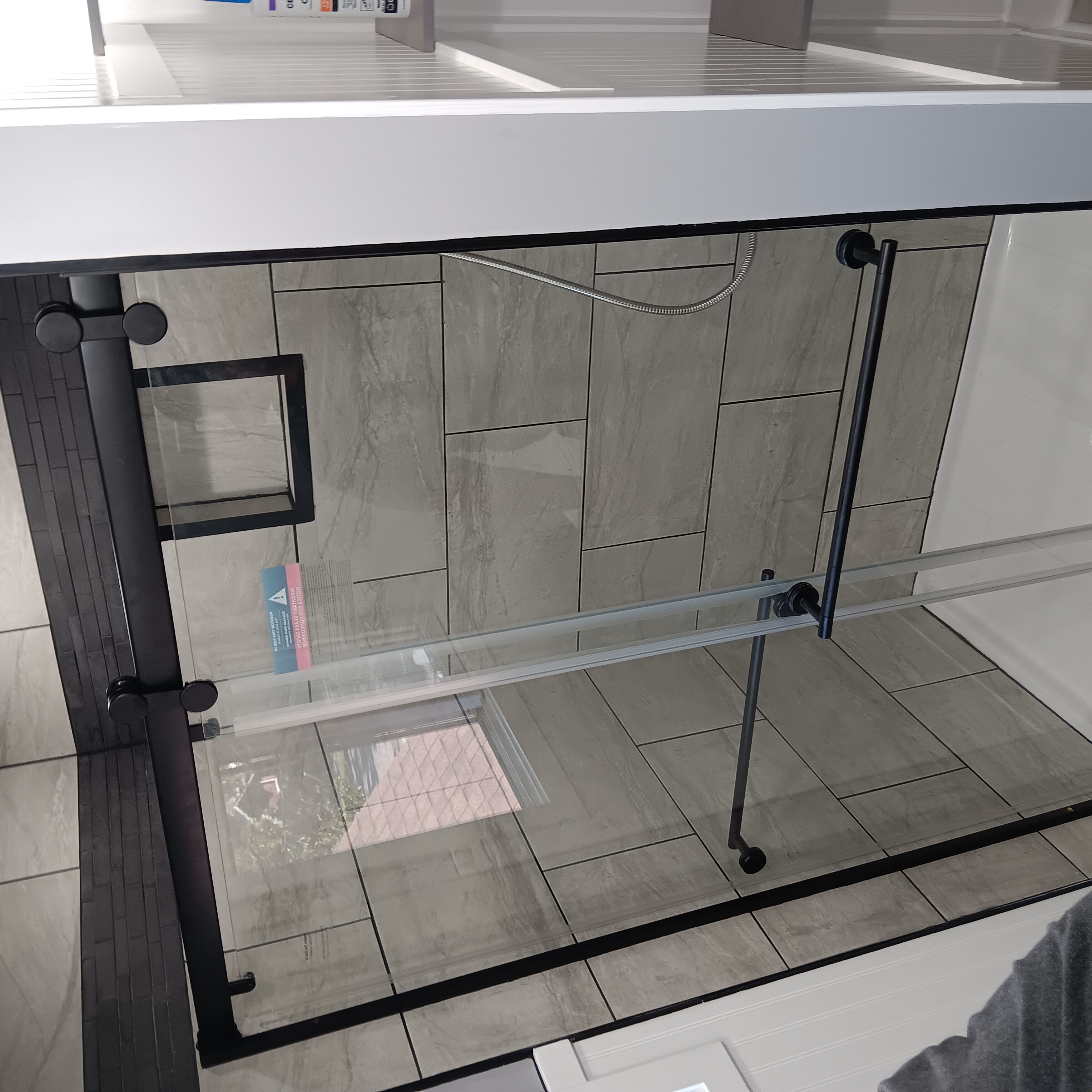 Tile shower with glass enclosure